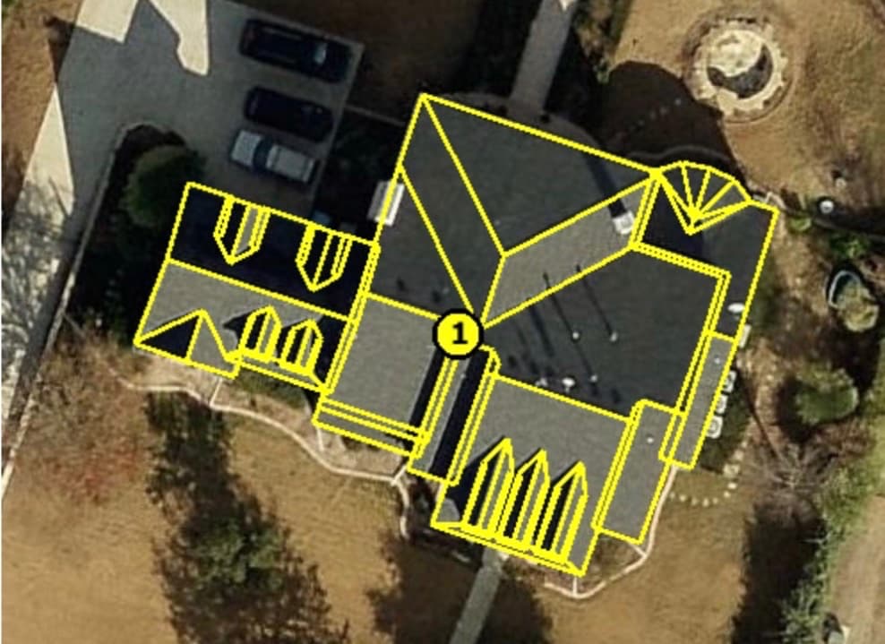 Aerial view of a complex roof with every facet, valley and ridge traced from measurement imagery